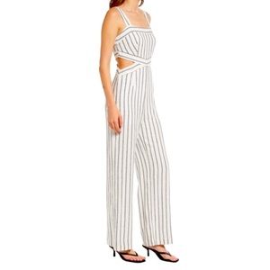 Great summertime striped linen jumpsuit with cutouts. Great for many occasions